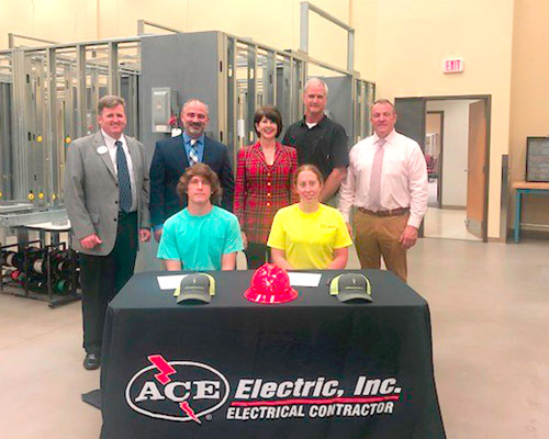 Apprentice with officials from Ace Electric and Wiregrass Georgia Tech