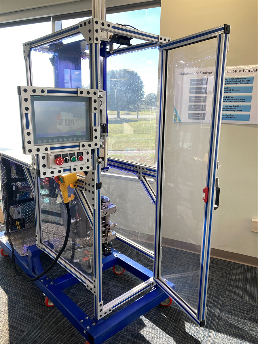 Blue Triton uses the blow mold simulator created by Wiregrass Mechatronics students as a teaching tool for new employees.